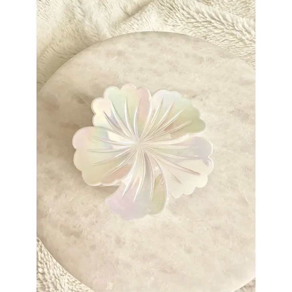 Iridescent white hibiscus flower hair claw